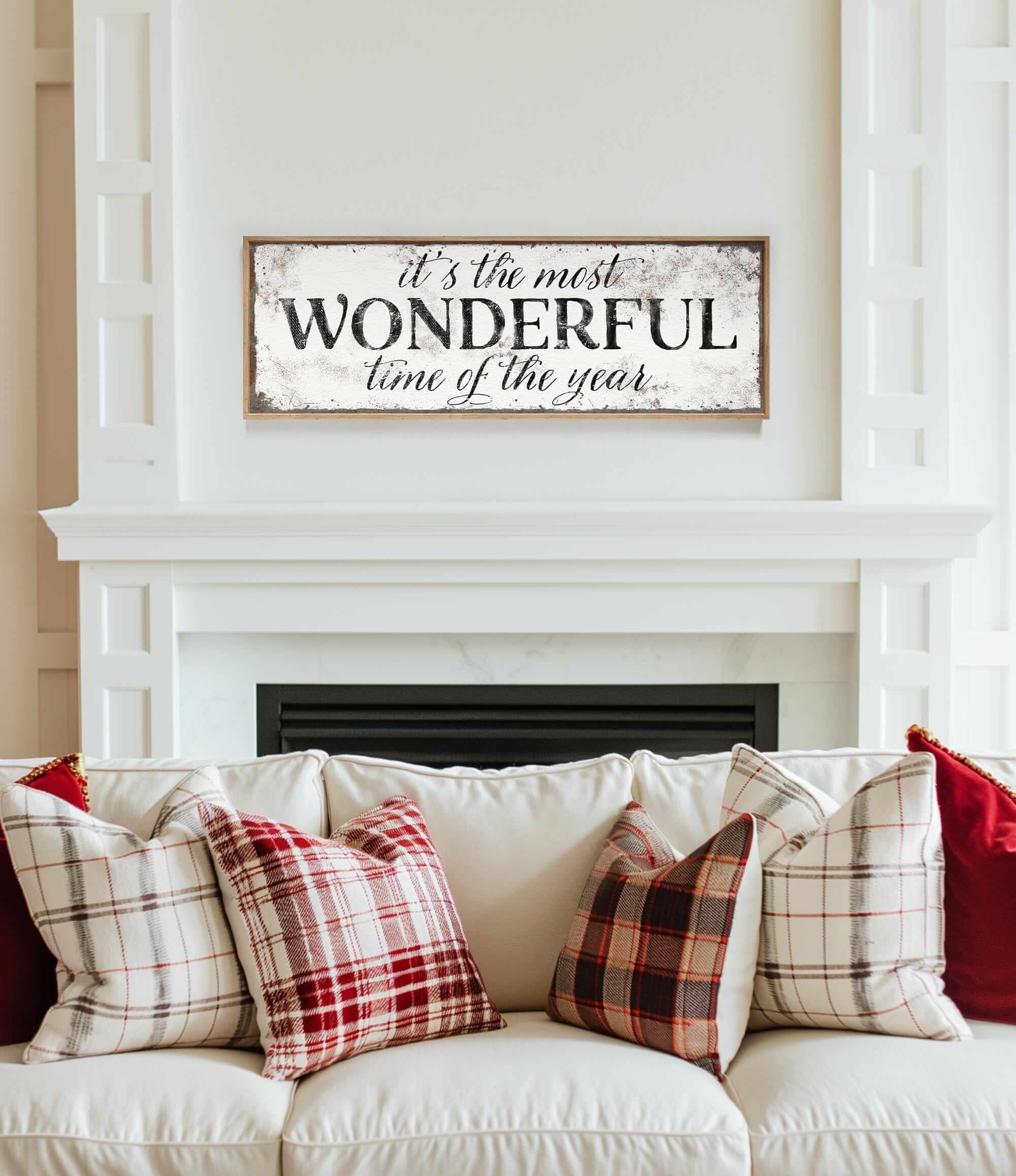 a living room with a white couch and a fireplace