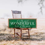 a wooden rocking chair with a sign that says, it's the most wonderful