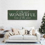 a living room with a couch and a christmas tree