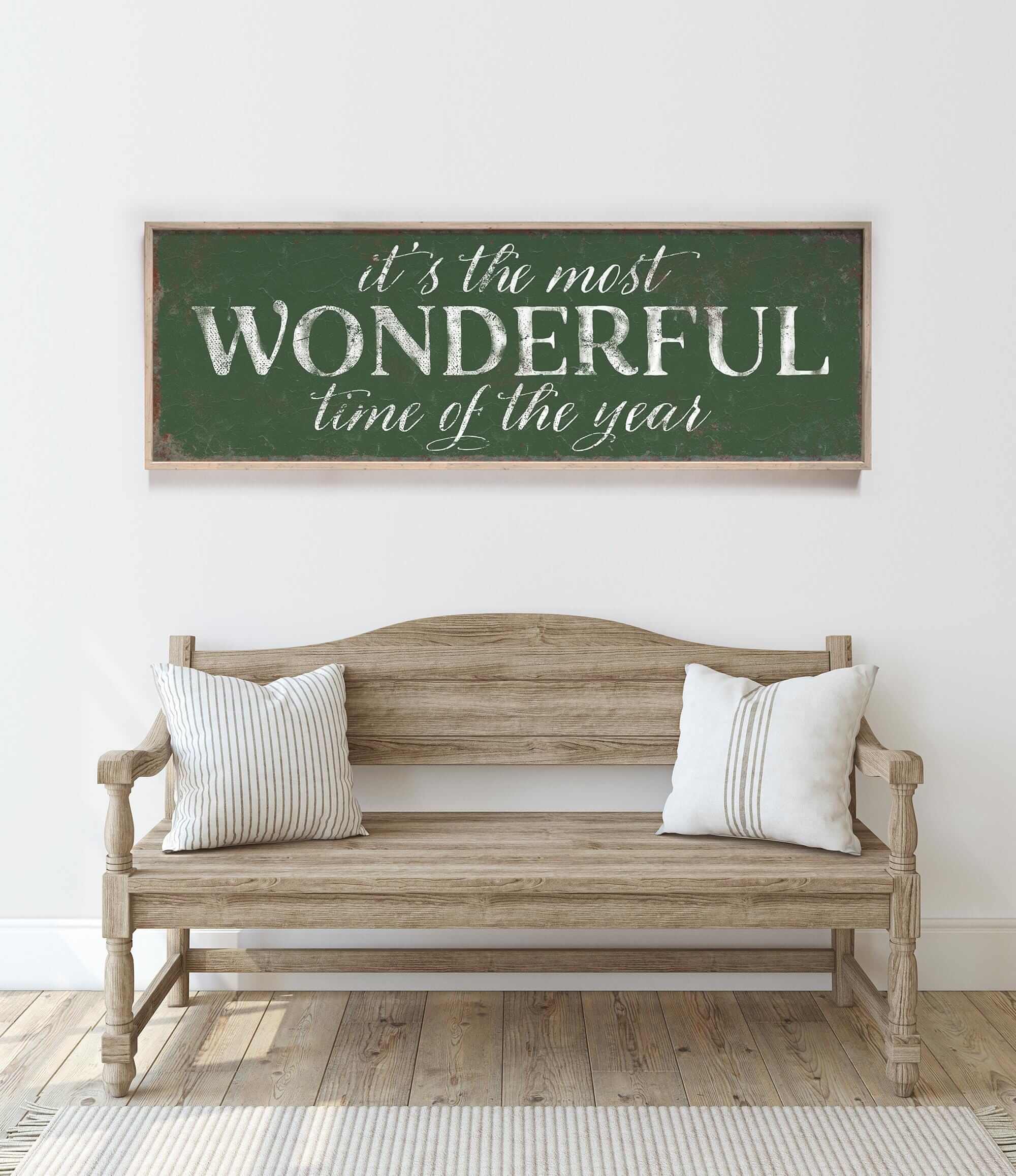 a wooden bench sitting in front of a white wall