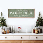 a wooden sign that says it's the most wonderful time of the year
