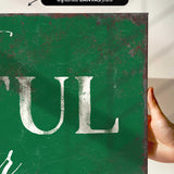 a hand holding a green sign that says tull