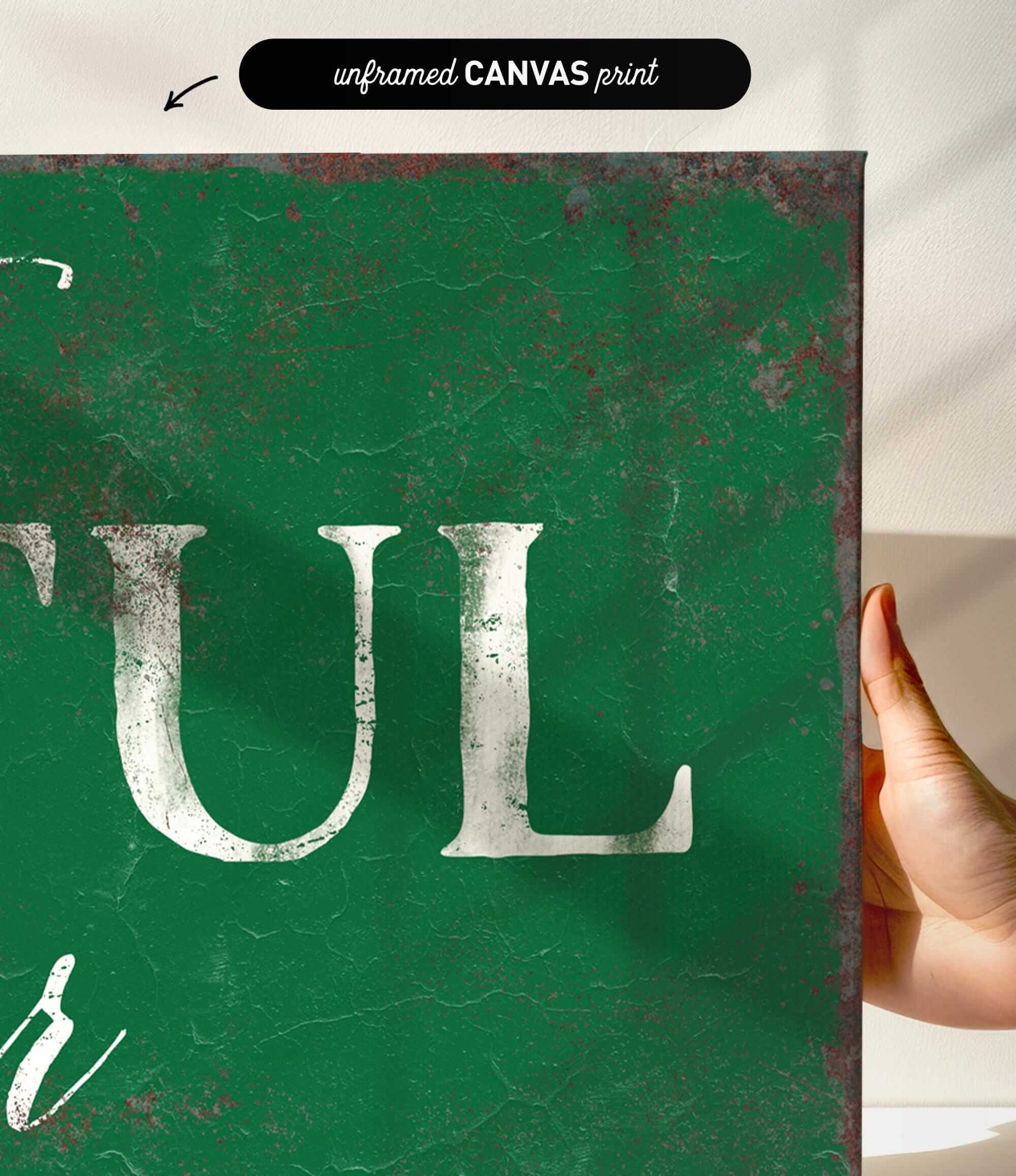 a hand holding a green sign that says tull