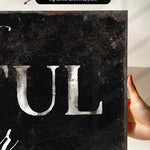 a person holding up a sign that says tull