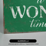 a green sign that says it's a wonderful time