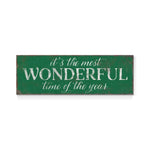 a green sign that says it's the most wonderful time of the year