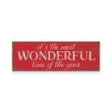 a red sign that says it's the most wonderful time of the year