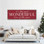 a living room with a couch and a christmas tree