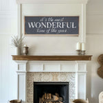 a fireplace with a sign above it that says it's the most wonderful time