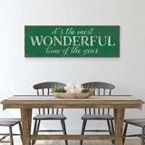 a table with chairs and a sign that says it's the most wonderful time