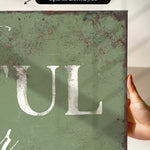 a person holding up a sign that says tull