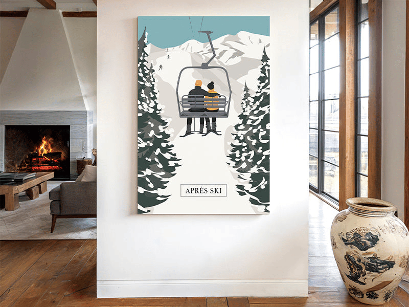 A painting of two people on a ski lift hangs on a modern living room wall near a fireplace and large windows.