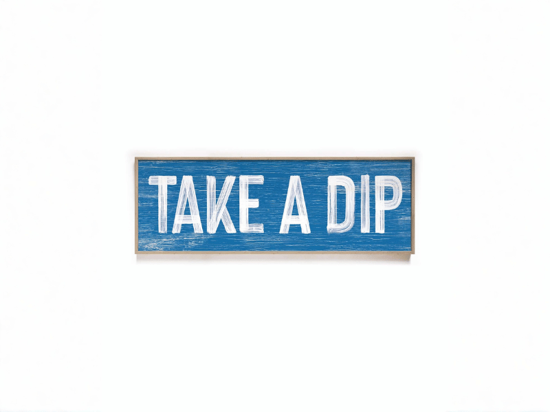 Blue wooden sign with white text that says "TAKE A DIP.