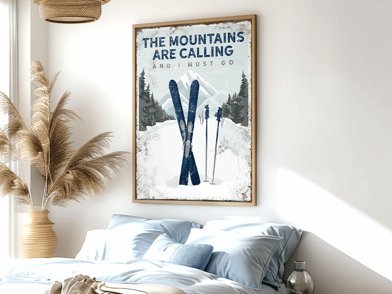 A sign with skis and poles in snow reads, "The mountains are calling and I must go," with trees and mountains.