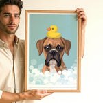 A man is holding a framed picture of a dog with a yellow rubber duck on its head, surrounded by bubbles.
