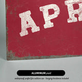 The image is an aluminum print with the text "APR" in white letters on a red background.