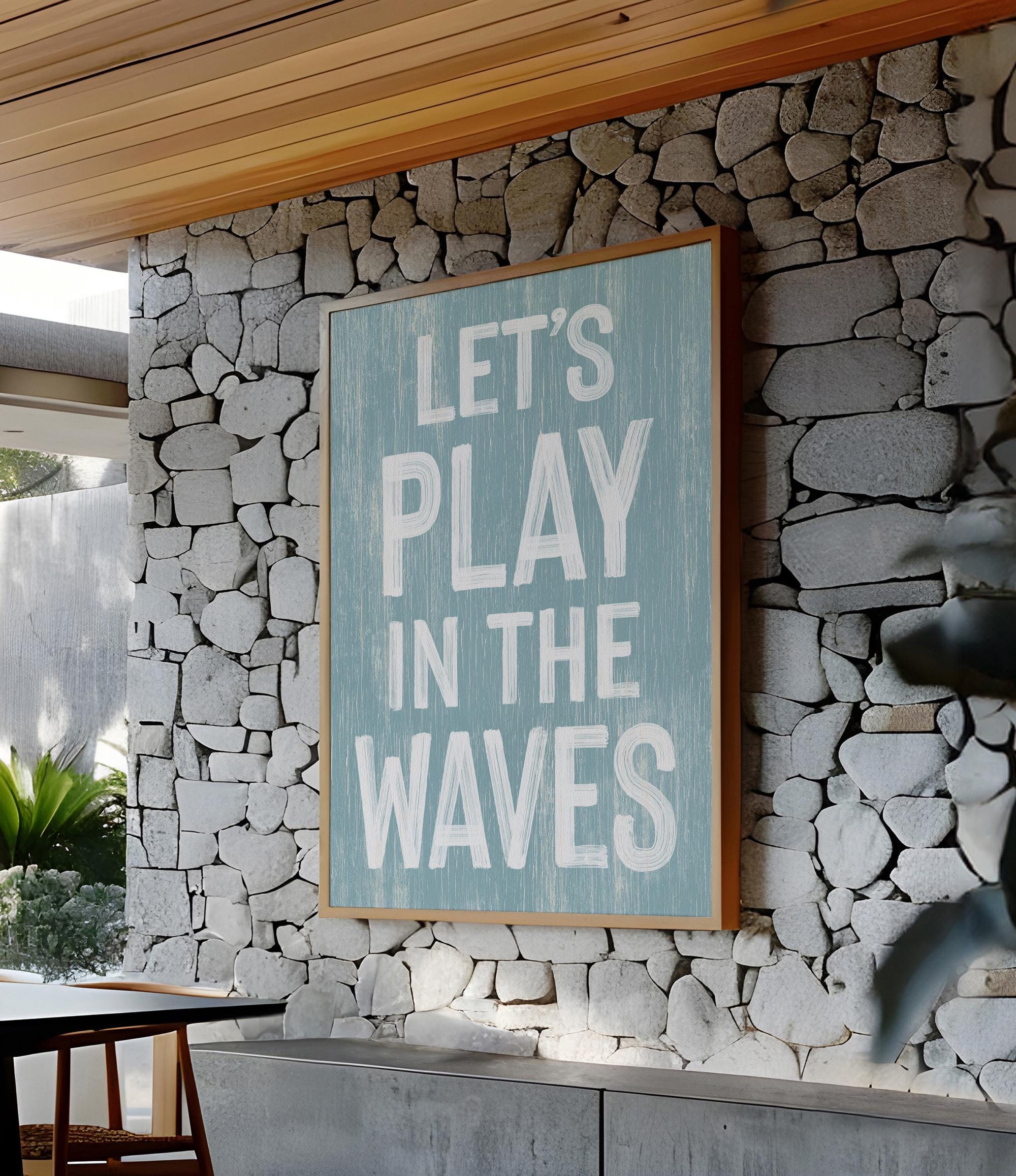 a sign that says let&#39;s play in the waves