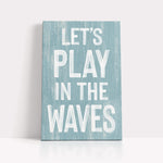 a wooden sign that says let&#39;s play in the waves