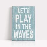 a wooden sign that says let&#39;s play in the waves