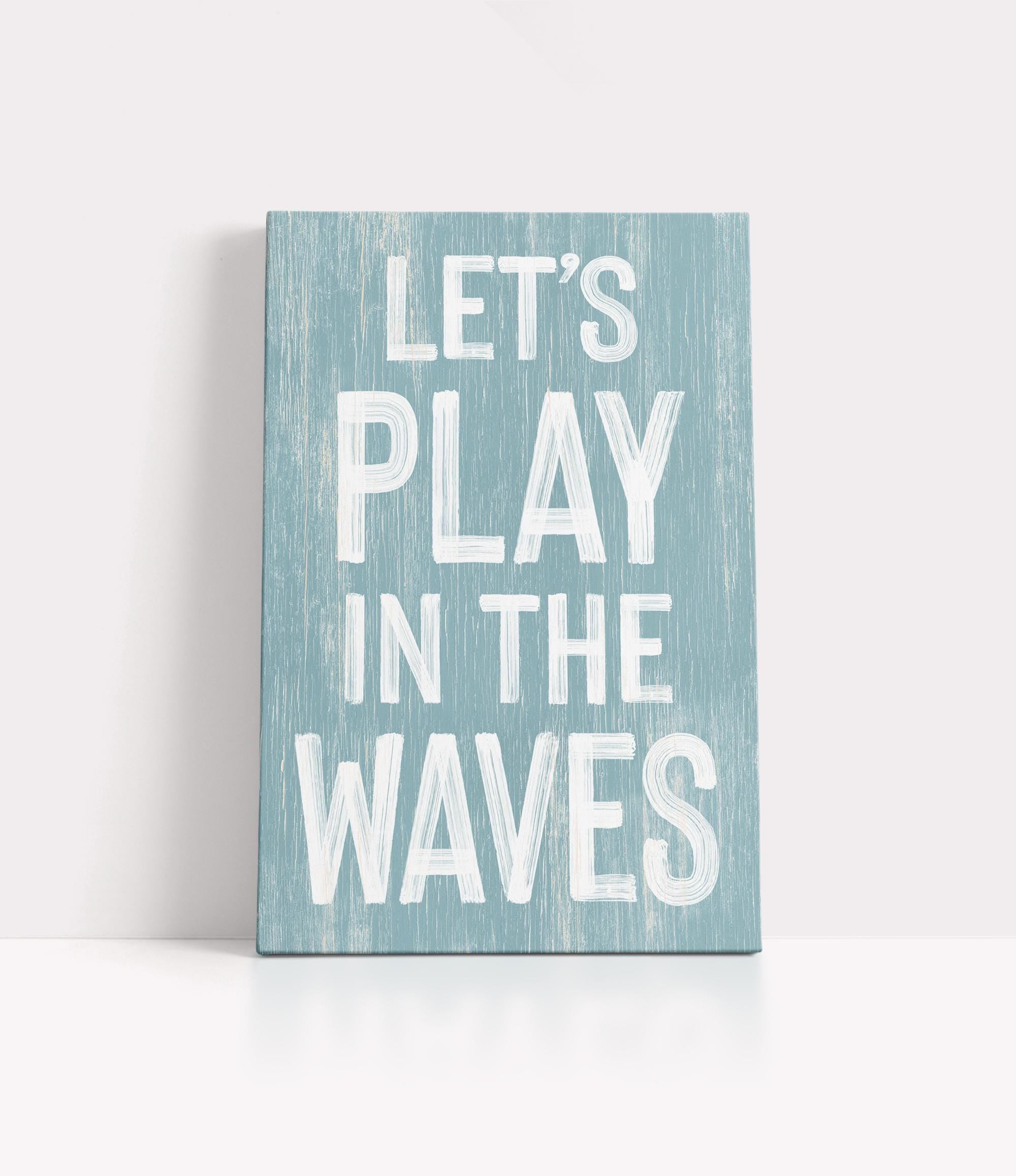 a wooden sign that says let&#39;s play in the waves