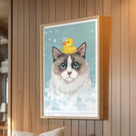 A framed illustration of a cat with a yellow rubber duck on its head, set against a blue background with white bubbles.