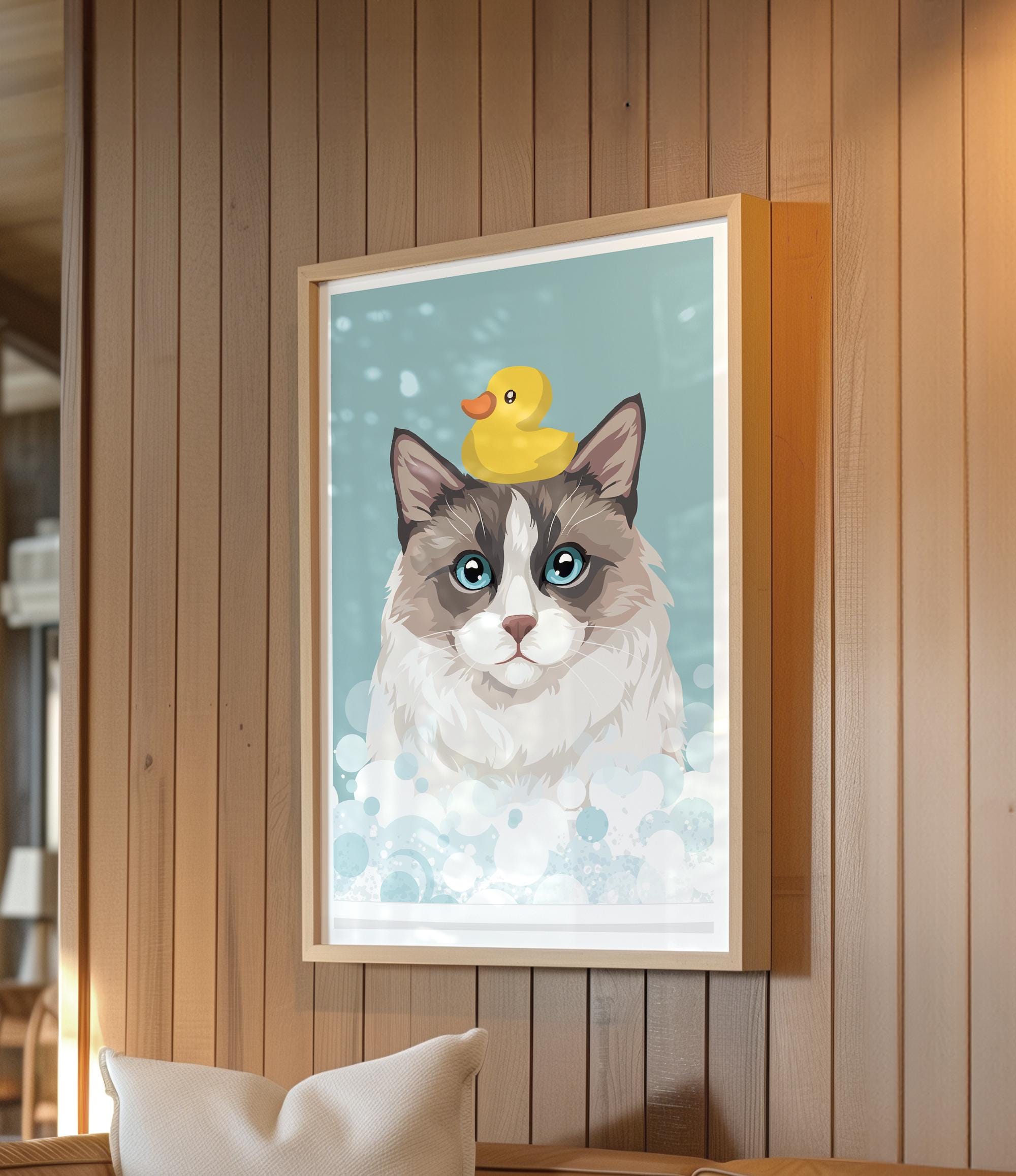 A framed illustration of a cat with a yellow rubber duck on its head, set against a blue background with white bubbles.