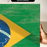 a person holding a piece of wood with a flag painted on it