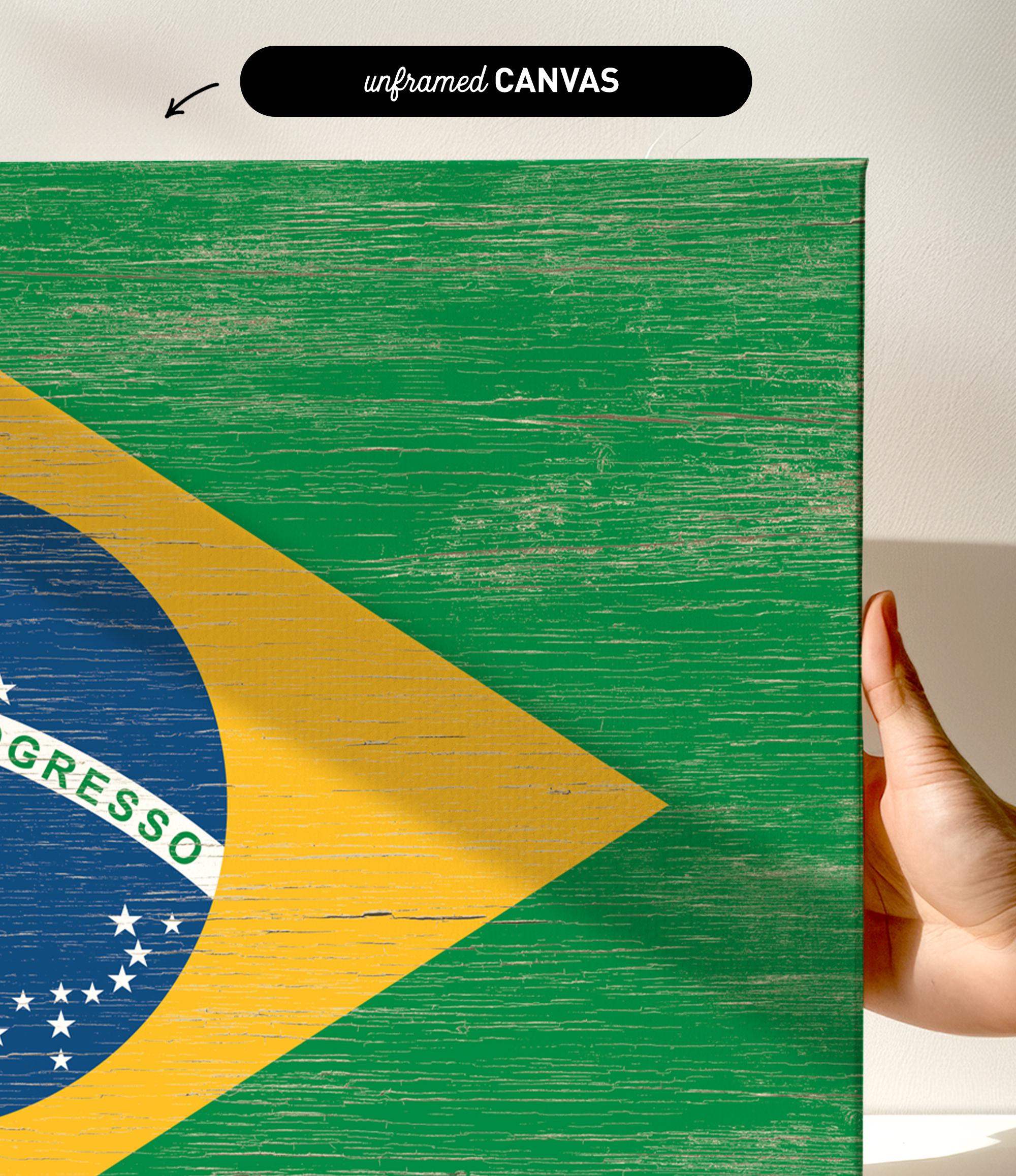 a person holding a piece of wood with a flag painted on it