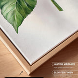 a close-up view of a canvas print with a natural frame, showcasing a detailed painting of a green leaf.