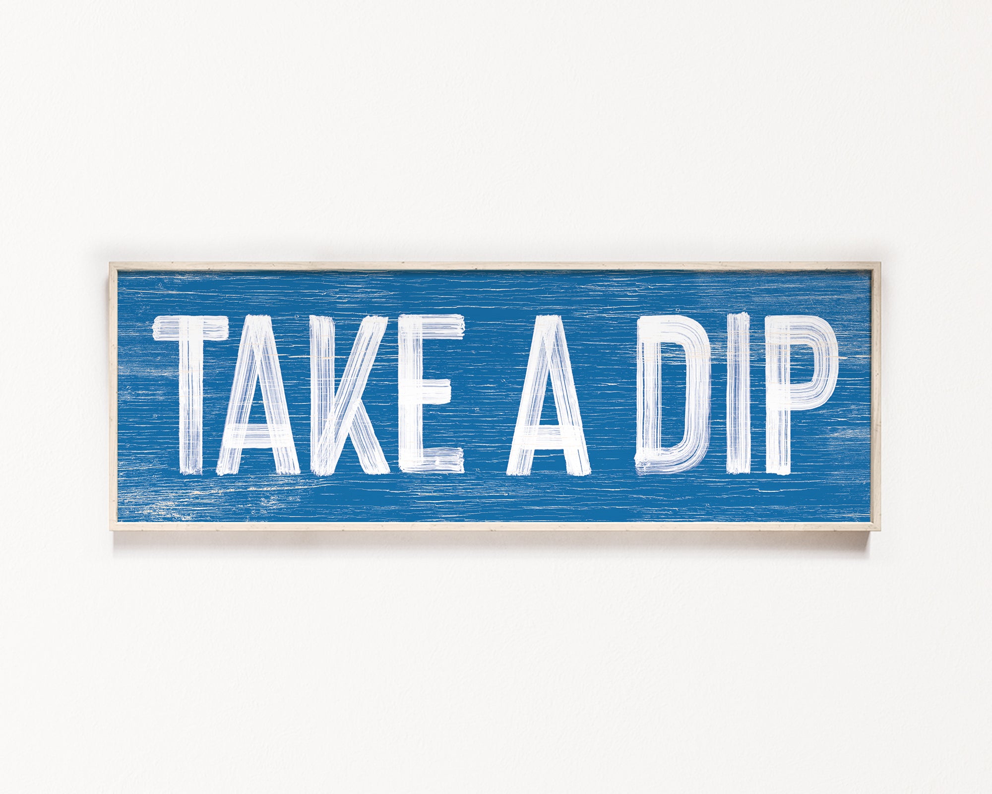 a blue sign that says take a dip