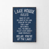 a sign that says lake house rules hanging on a wall