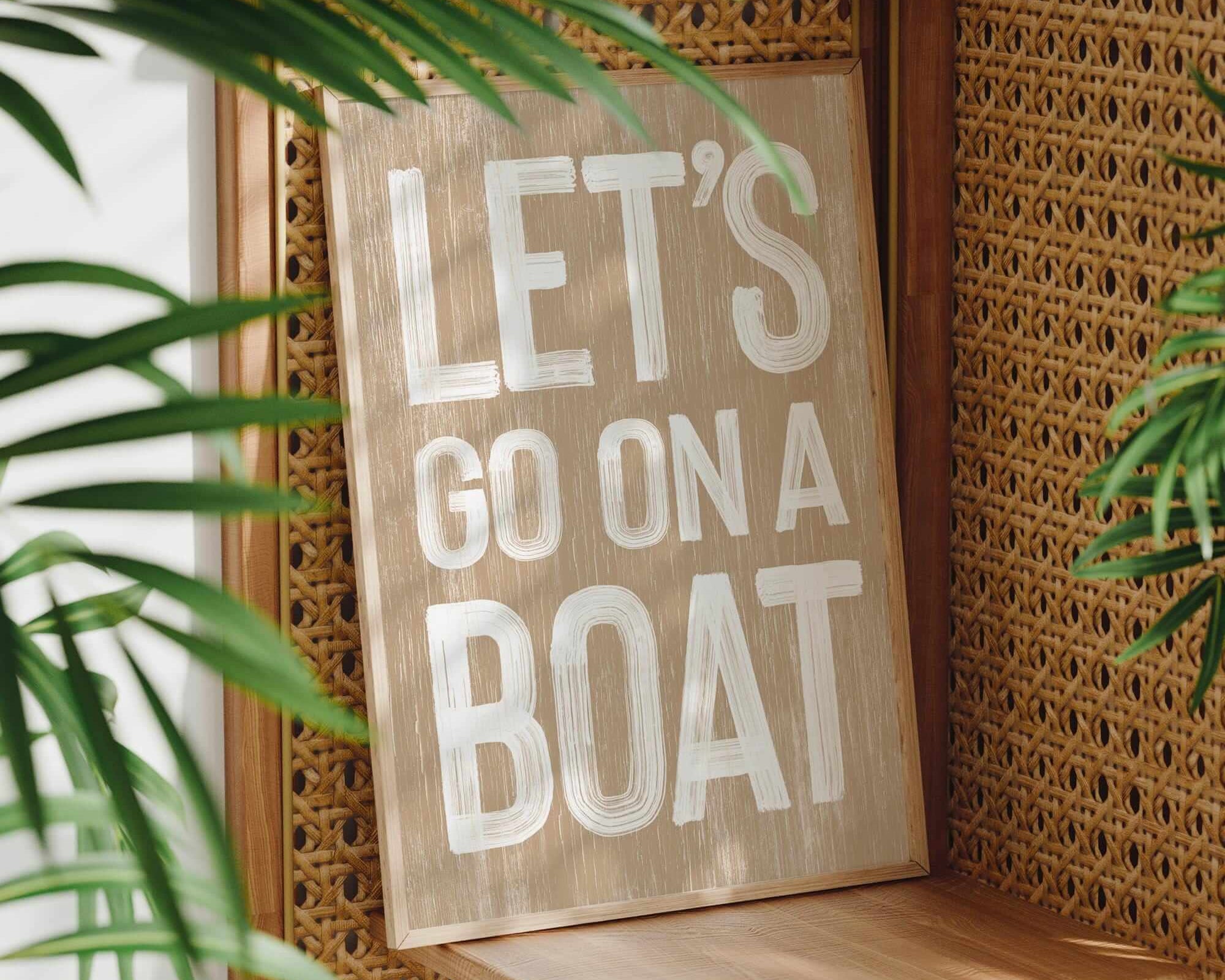 a wooden sign that says let's go on a boat
