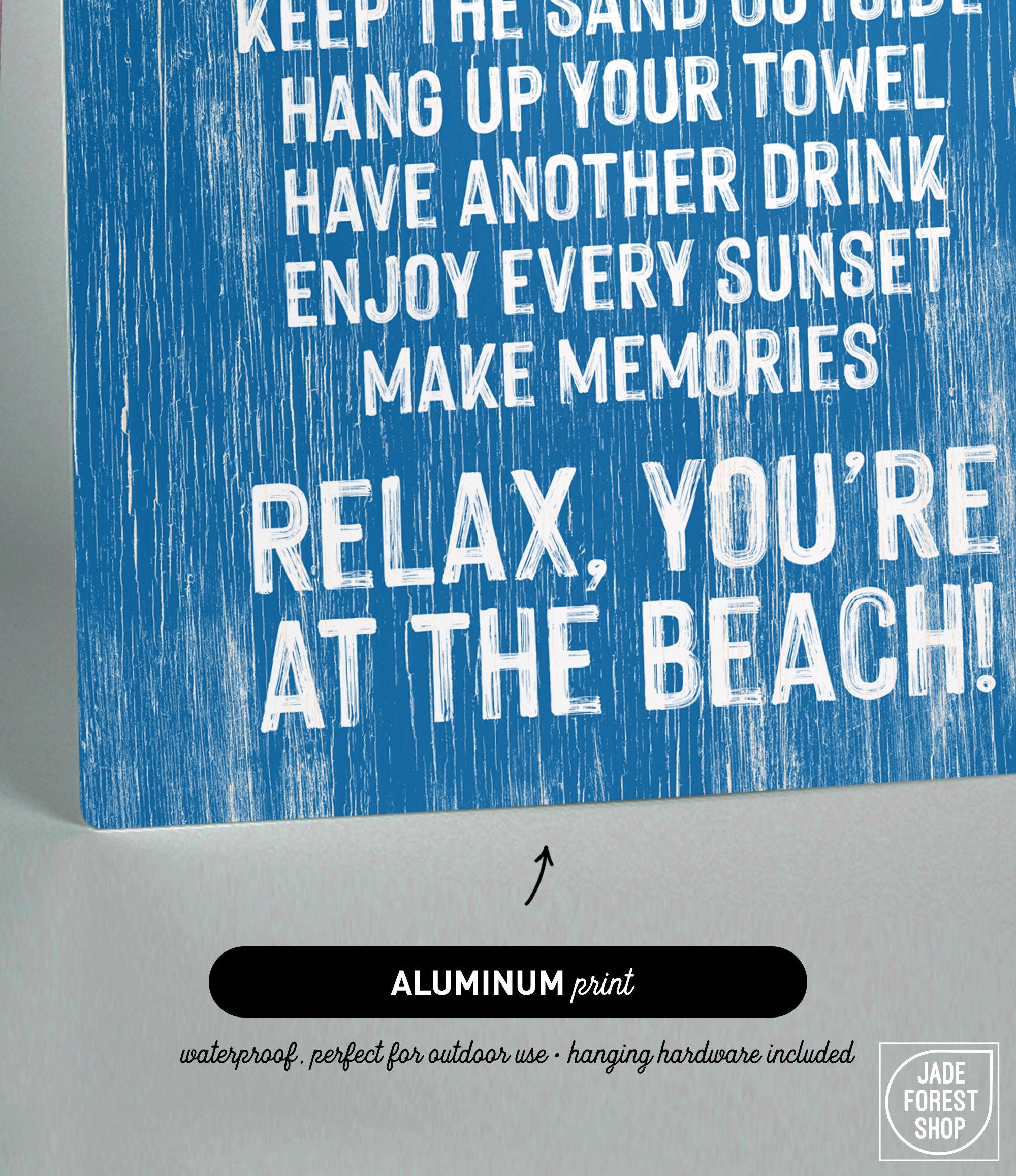The Beach House Rules Sign, crafted from painted wood in ocean blue, features bold white text—"Relax, you're at the beach!"—making it a cheerful addition to any coastal wall art or beach house decor.
