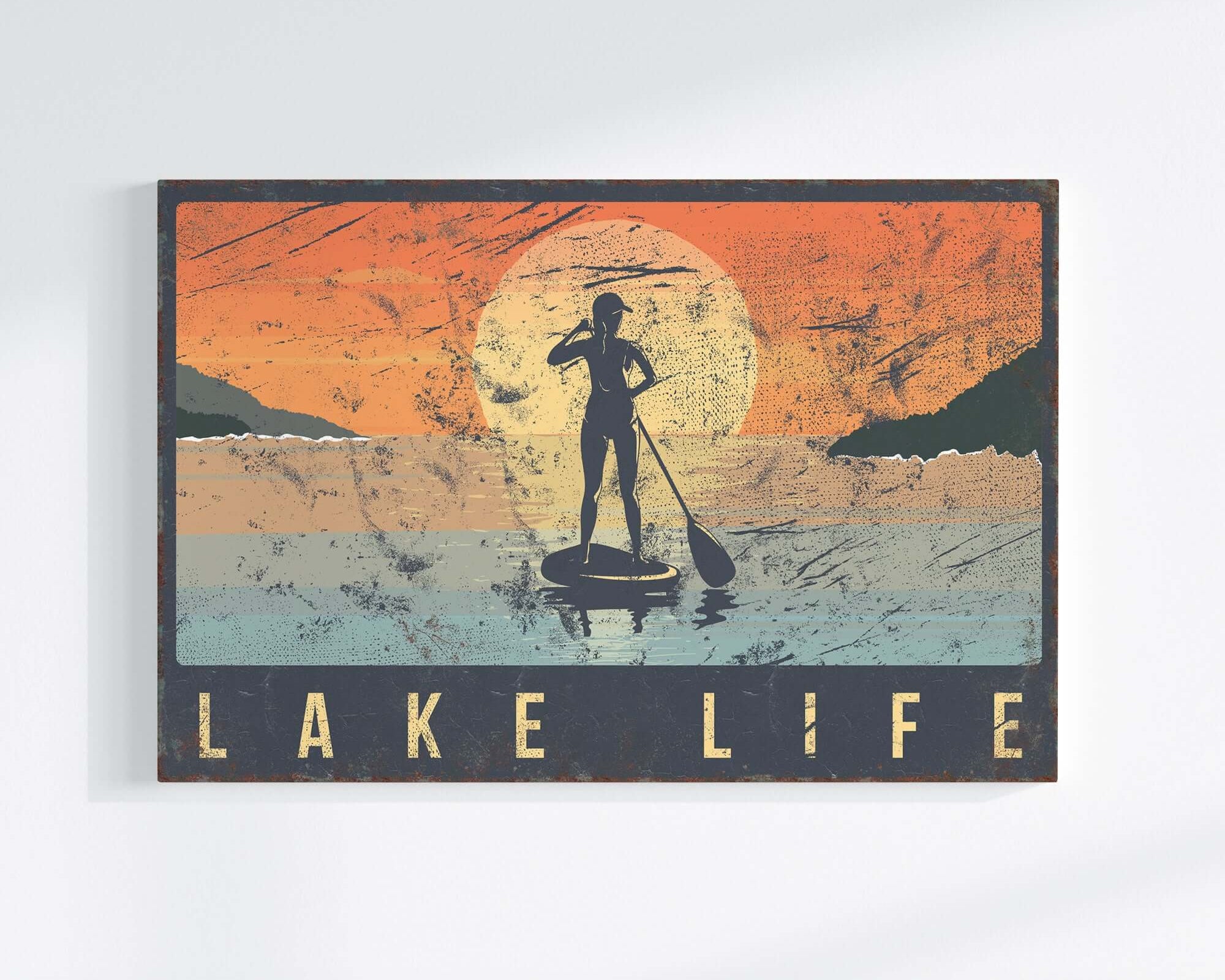 a picture of a man on a surfboard with a sunset in the background