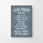 The image is a sign that provides a list of rules for visitors at a lake house.