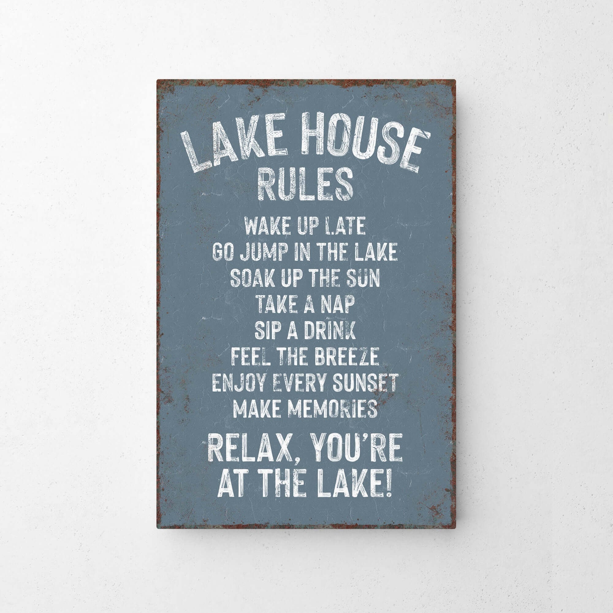 The image is a sign that provides a list of rules for visitors at a lake house.