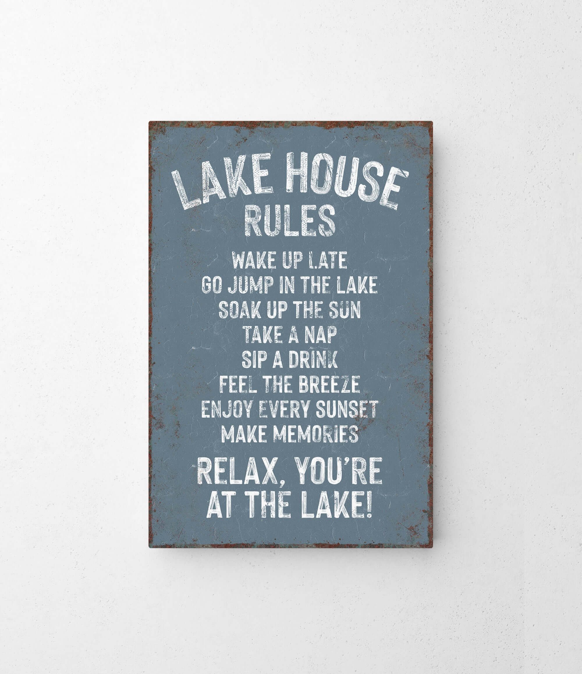 The image is a sign that provides a list of rules for visitors at a lake house.