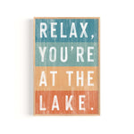 a wooden sign that says relax you're at the lake