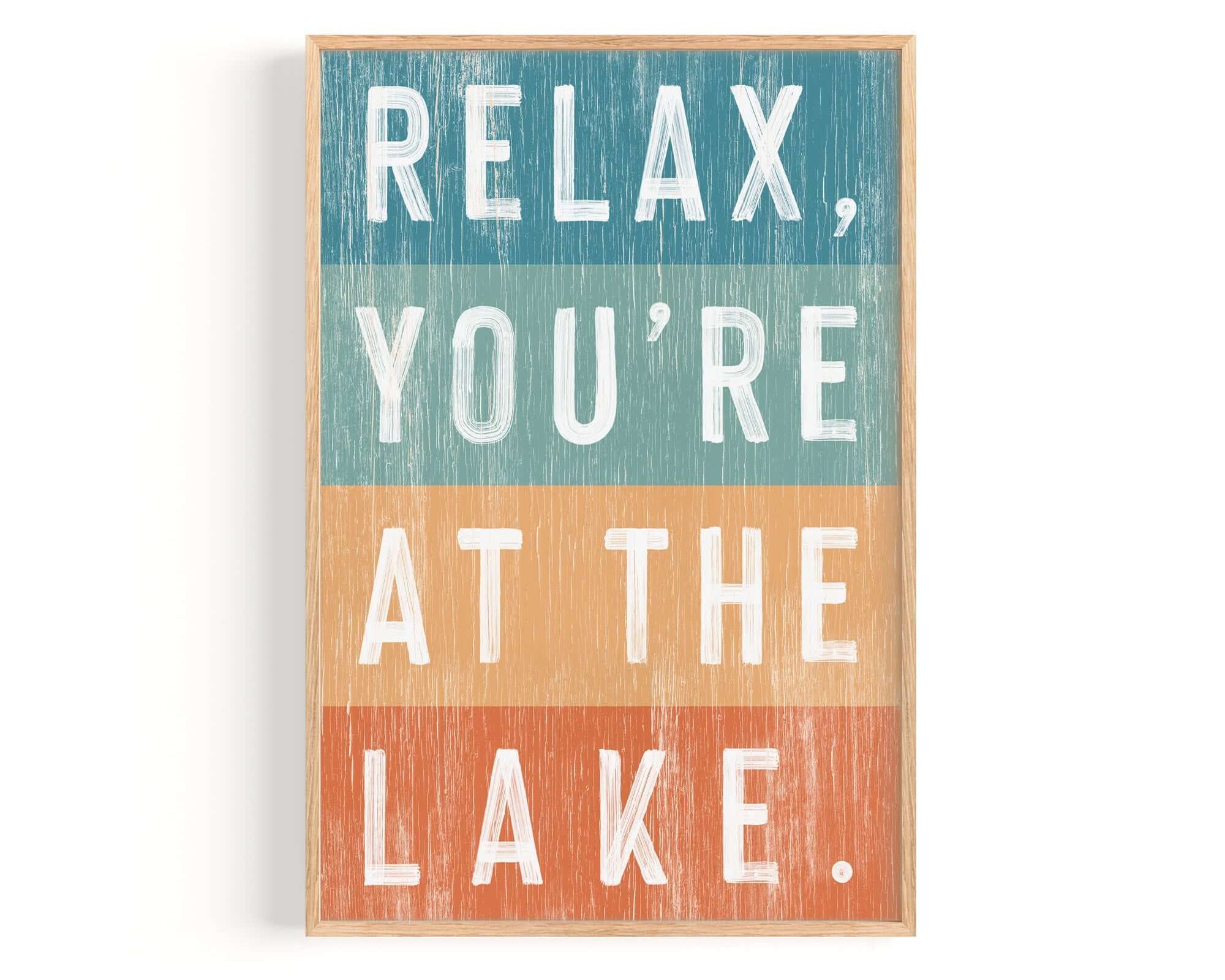 a wooden sign that says relax you're at the lake