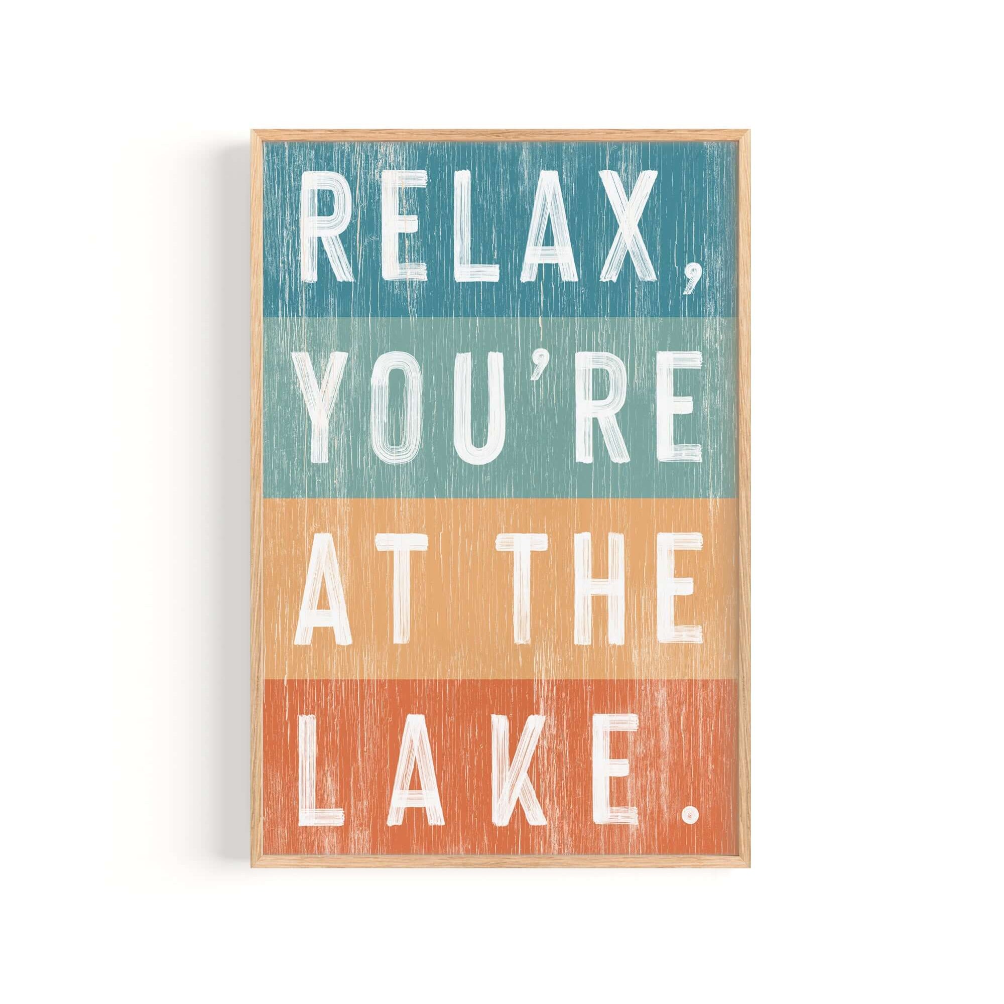 a wooden sign that says relax you're at the lake