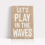 a wooden sign that says let&#39;s play in the waves