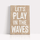 a wooden sign that says let&#39;s play in the waves