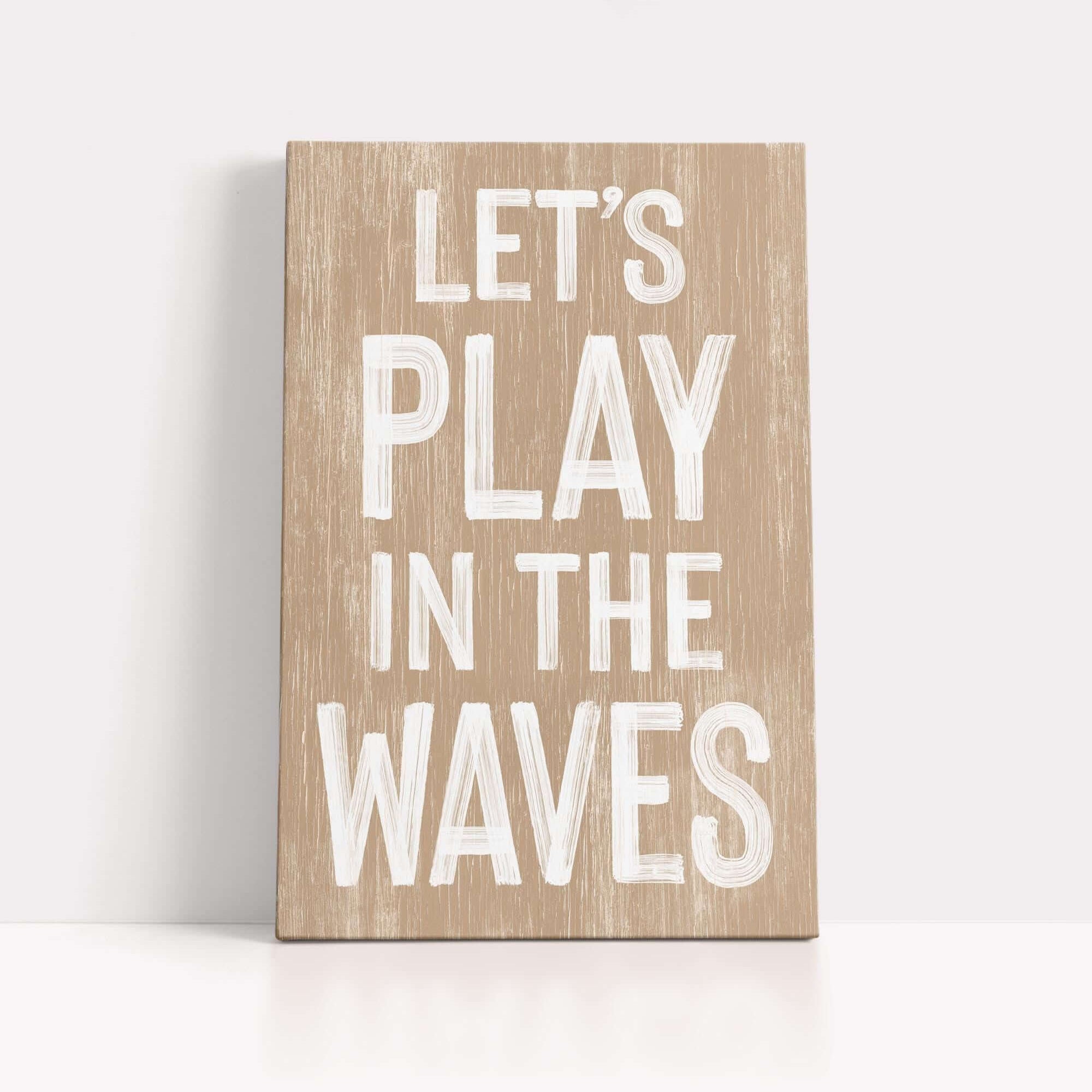 a wooden sign that says let's play in the waves