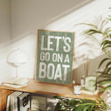 a wooden sign that says let&#39;s go on a boat