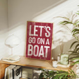 a wooden sign that says let&#39;s go on a boat