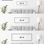 a series of three framed artworks or photographs displayed on a wall, each with a different size and frame. The artworks are arranged in a row, with the largest one being 24 x 8 inches, followed by a smaller one of 36 x 12 inches, and the smallest one being 48 x 16 inches. The artworks are set against a white wall, and there is a plant in the background.