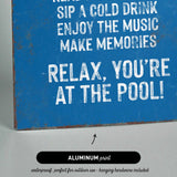 a blue sign that says relax you&#39;re at the pool