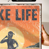 a person holding up a sign that says take life