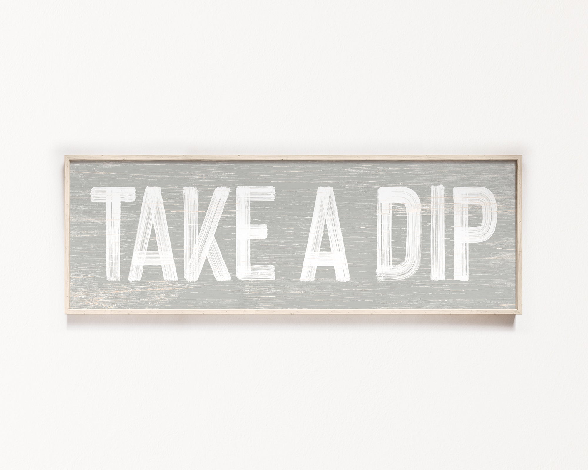 a wooden sign that says take a dip