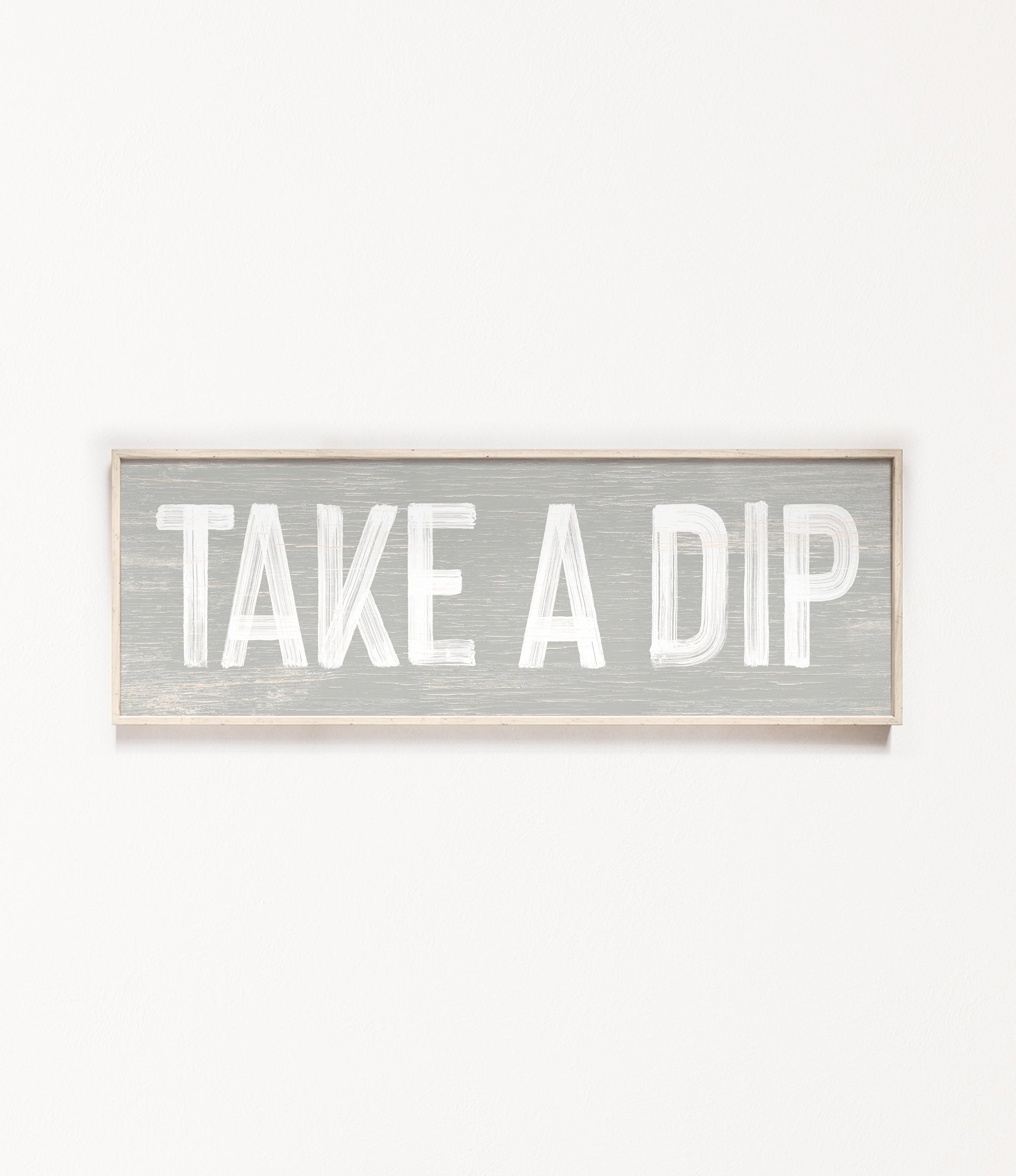 a wooden sign that says take a dip